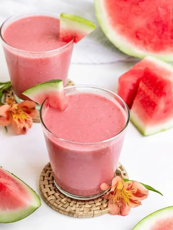 two strawberry watermelon smoothies in short glasses